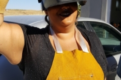 Student getting ready to weld with mentor