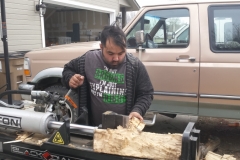 Students splitting wood