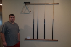 Student designed and built pool stick holder