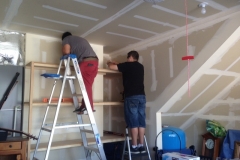 Students working off campus on a house project.
