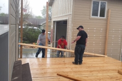 Students and mentor installing new deck
